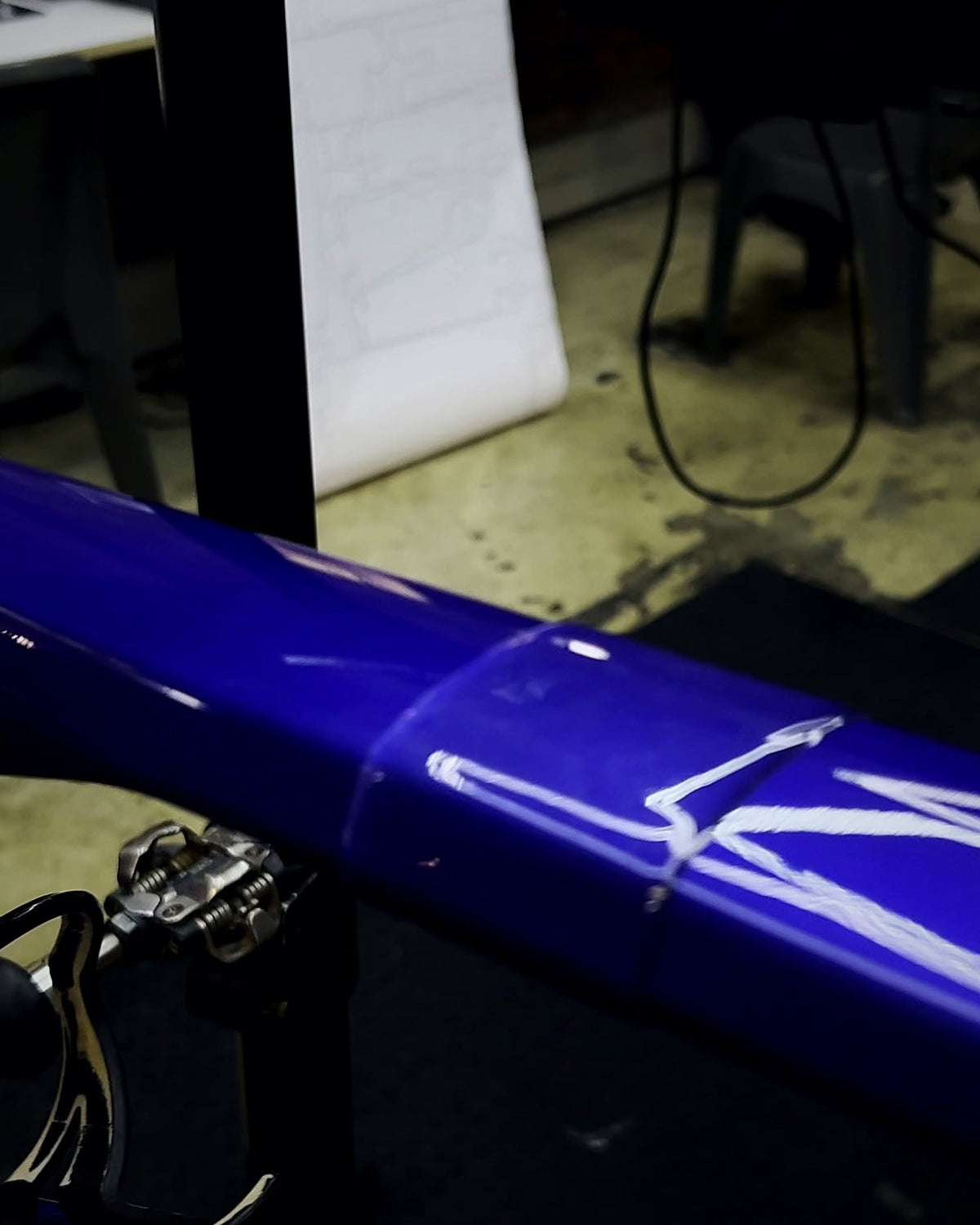 Clear TPU protection film applied to a blue mountain bike top tube